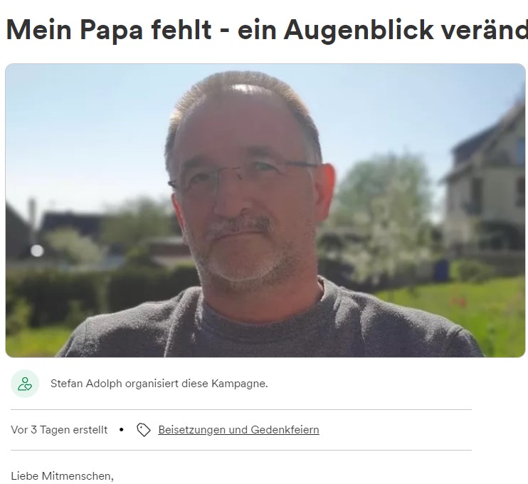 Portrait eines Mannes mit Brille, hinter ihm ein verschwommener Garten.