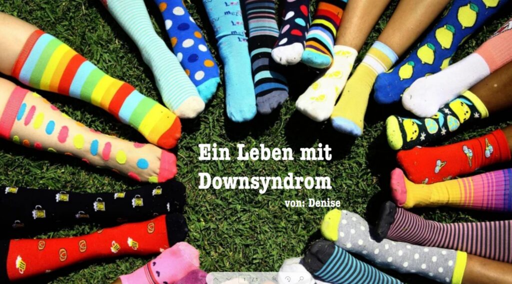 Bunte Socken auf grünem Rasen, um einen Text über Downsyndrom.