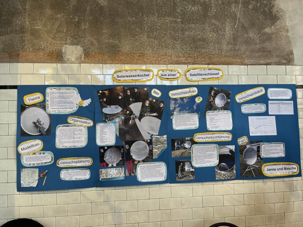 Das Bild zeigt ein Ausstellungsplakat mit Informationen zu verschiedenen Experimenten.
